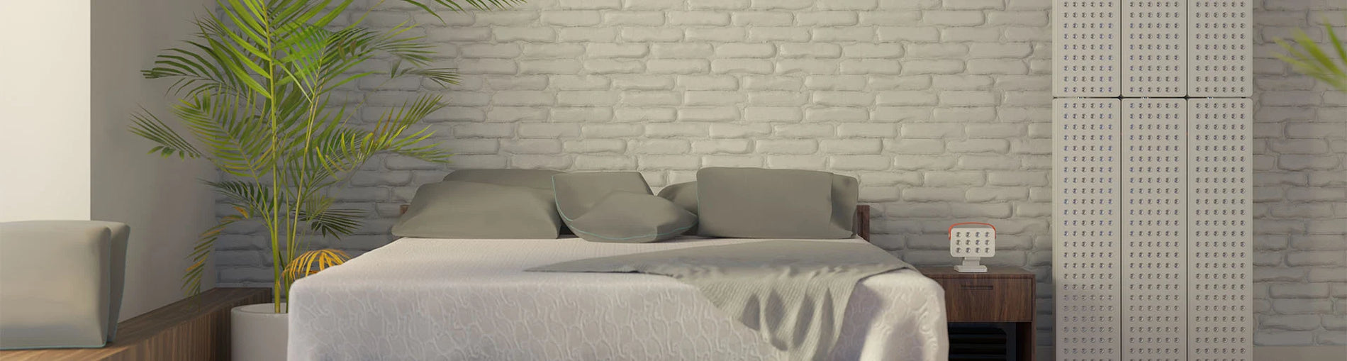 Modern bedroom with gray bedding, nightstands, and a Joovv Elite device mounted on the wall